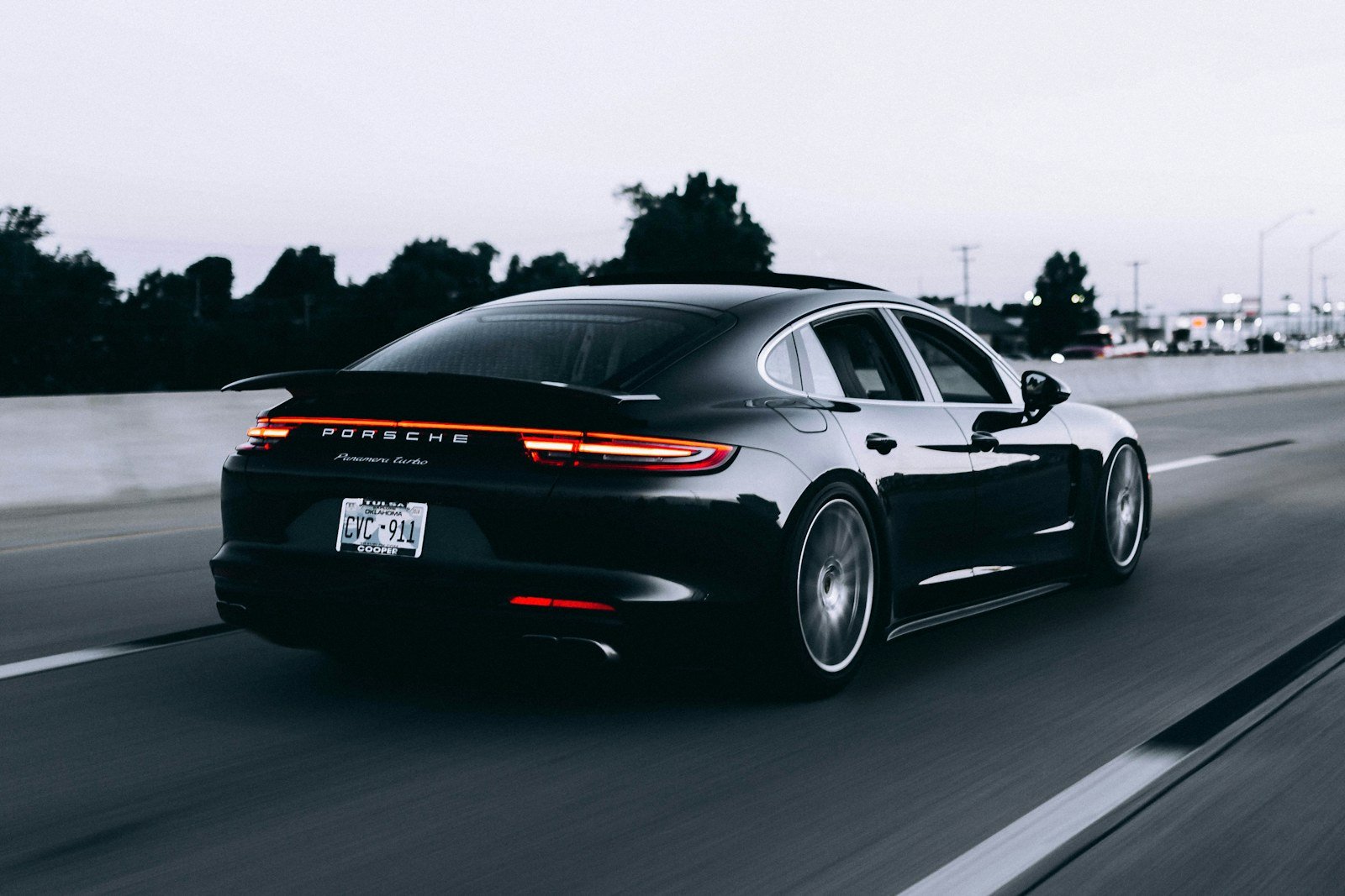 Black performance car on the road